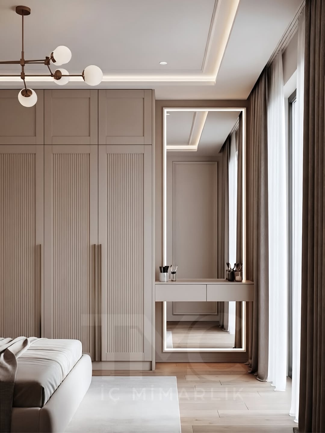 Modern giyinme alanı tasarımında vizon renk paleti, gizli kulp detayları ve LED aydınlatmalı makyaj alanı ile estetik ve fonksiyonel çözümler bir araya getirildi.