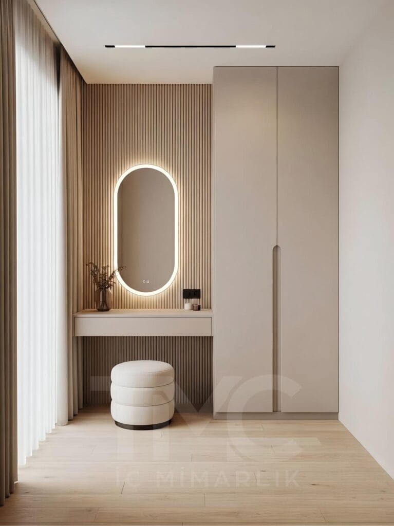Modern giyinme odası ve makyaj masası tasarımı, ölçüye özel dolap sistemi, entegre LED aydınlatmalı ayna, açık ton modern iç mimari, minimal kapaklı gardırop ve fonksiyonel depolama çözümleri – TMC Mimarlık