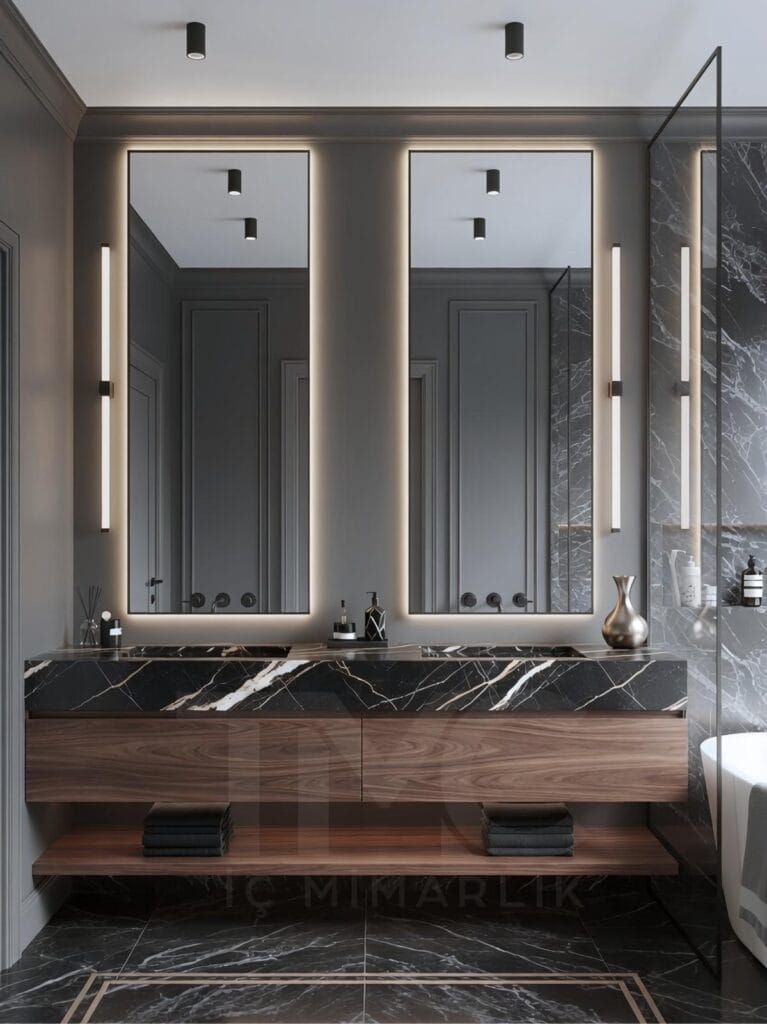 Limonlu Bahçe Konakları’nda tasarlanan modern banyo projesi; mermer tezgâh, arka aydınlatmalı aynalar ve minimal tasarım detayları ile lüks ve ferah bir iç mekân sunmaktadır.