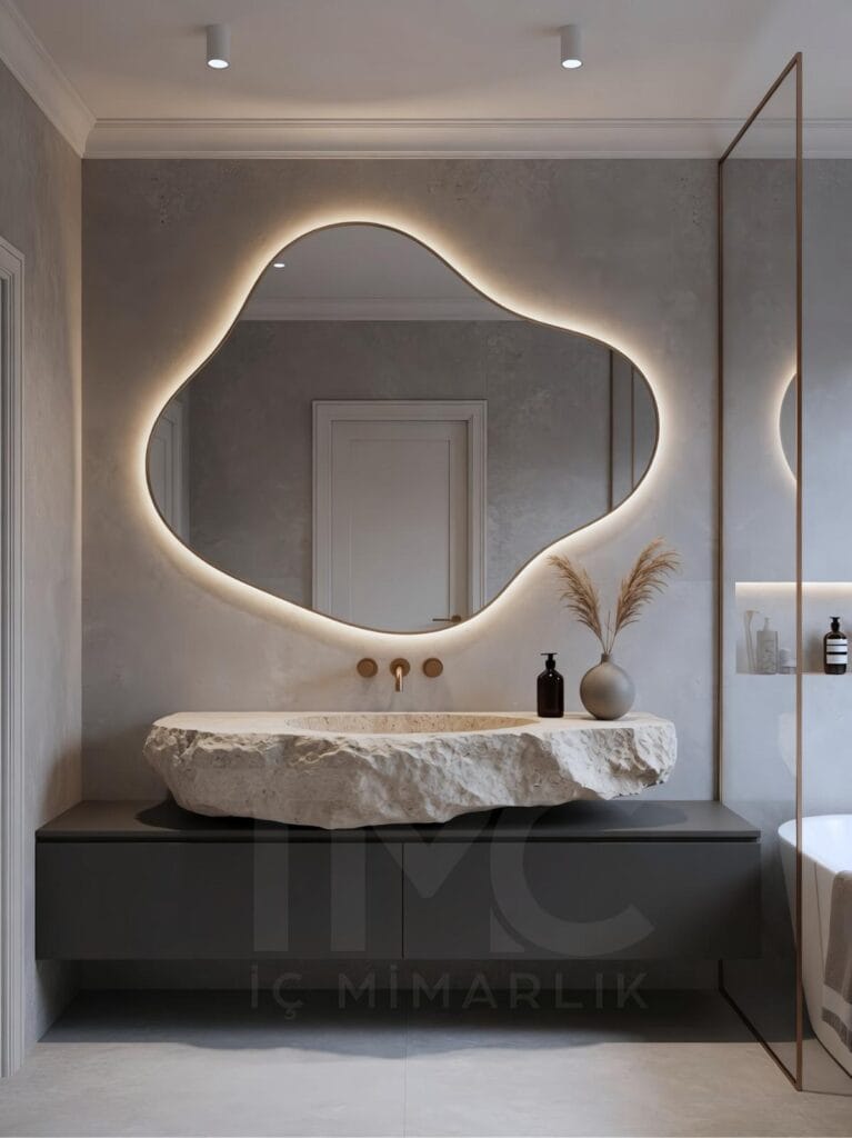 Limonlu Bahçe Konakları’nda tasarlanan modern banyo projesi; mermer tezgâh, arka aydınlatmalı aynalar ve minimal tasarım detayları ile lüks ve ferah bir iç mekân sunmaktadır.