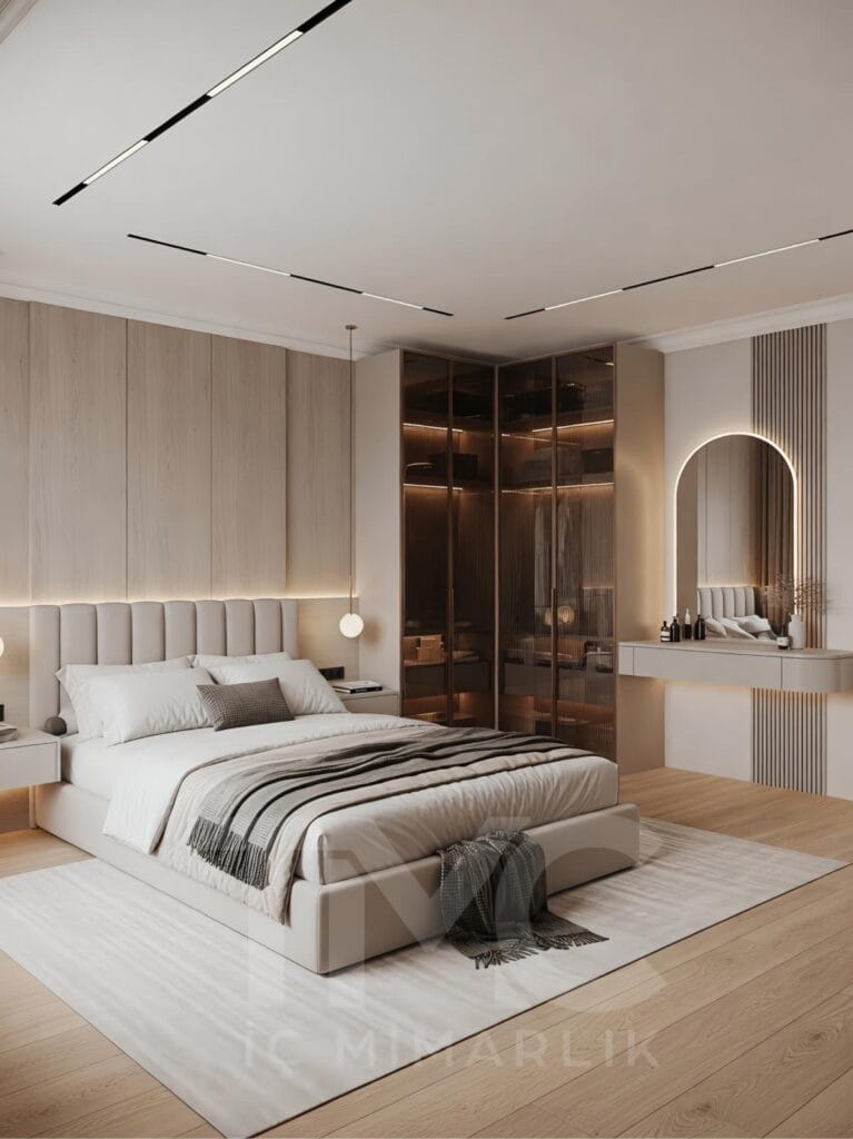 Modern yatak odası tasarımı, Bomonti Rotana Residence Emir Bey projesi, vizon ve açık meşe tonlarında özel tasarım yatak odası, led aydınlatmalı döşemeli yatak başlığı, bronz nervür cam gömme dolap sistemi, modern makyaj masası tasarımı, floating komodin detayları, minimal lineer tavan aydınlatmaları, lüks iç mimari yatak odası dekorasyonu, TMC Mimarlık modern yatak odası projesi