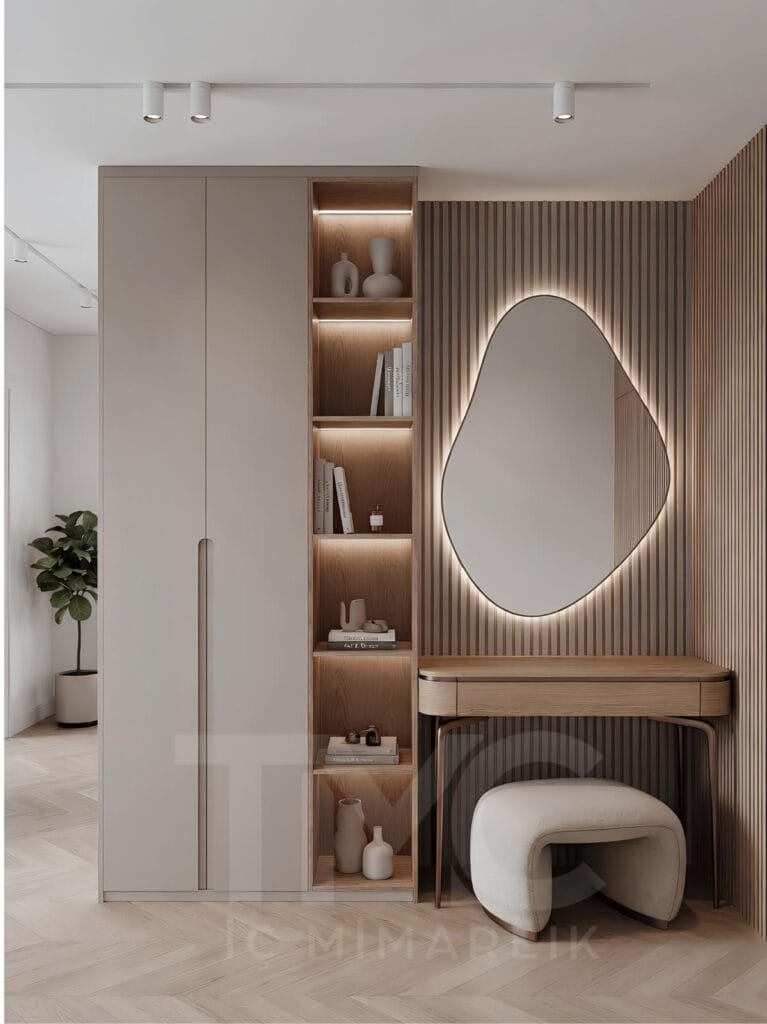 Modern antre tasarımı, özel üretim portmanto dolabı, LED aydınlatmalı dekoratif raf sistemi ve bronz detaylı ayna uygulaması ile tasarlanan Nuvo Dragos Duygu Hanım antre projesi. Açık krem tonları, doğal ahşap dokular ve modern çizgilerle tasarlanan giriş alanı, fonksiyonel depolama çözümleri ve premium iç mimari detaylarıyla dikkat çekiyor.