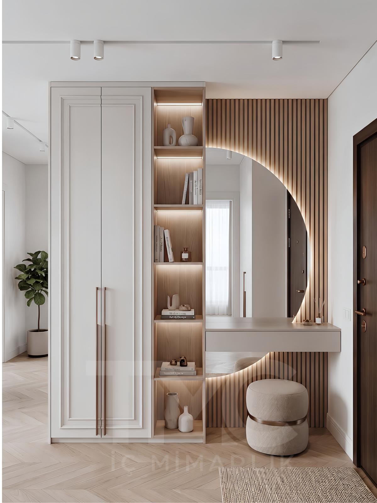 Modern antre tasarımı, özel üretim portmanto dolabı, LED aydınlatmalı dekoratif raf sistemi ve bronz detaylı ayna uygulaması ile tasarlanan Nuvo Dragos Duygu Hanım antre projesi. Açık krem tonları, doğal ahşap dokular ve modern çizgilerle tasarlanan giriş alanı, fonksiyonel depolama çözümleri ve premium iç mimari detaylarıyla dikkat çekiyor.