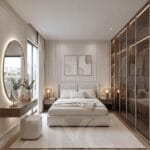 Modern yatak odası tasarımı, bronz reflekte cam gardırop sistemi, LED aydınlatmalı açık raf detayları, oval LED makyaj aynası ve doğal ahşap dokular ile tasarlanmış lüks yatak odası projesi. Ritim İstanbul’da TMC Mimarlık tarafından uygulanan modern yatak odası dekorasyonu, açık tonlu duvar panelleri, sıcak LED aydınlatmalar ve ölçüye özel depolama çözümleriyle sade ve premium bir yaşam alanı sunuyor.